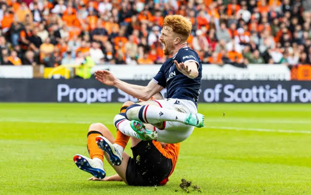 Dundee's Simon Murray is fouled by Dundee United's Ross Graham