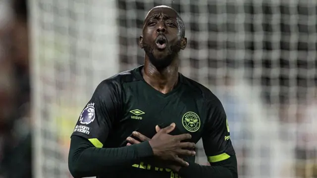 Yoane Wissa puts his hands on his chest as he celebrates scoring