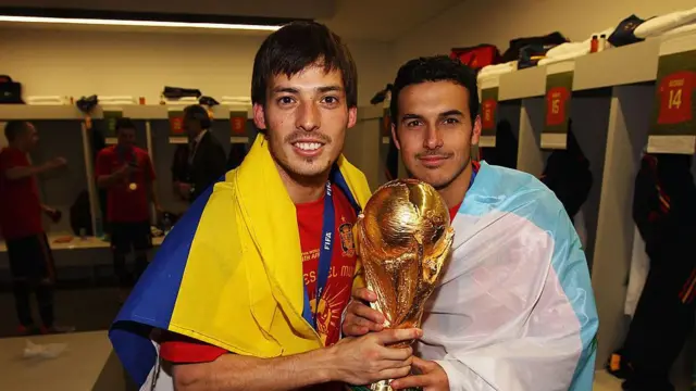  David Silva and Pedro Rodriguez of Spain pose with the World Cup trophy