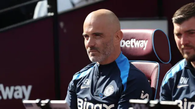 Enzo Maresca, Manager of Chelsea, looks on prior to the Premier League match between West Ham United FC and Chelsea FC at London Stadium