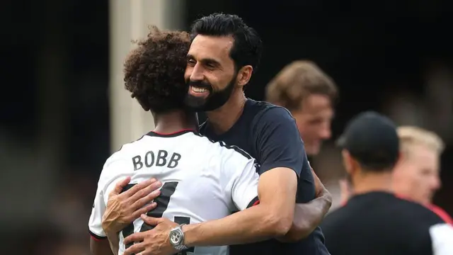 Alvaro Arbeloa embraces Oscar Bobb