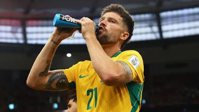 Cameron Burgess has a drink during Australia's World Cup game against Turkey 