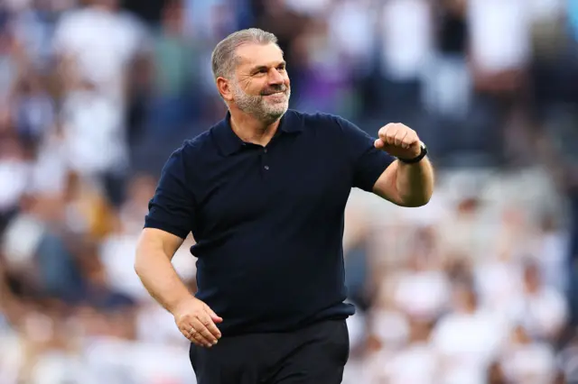 Ange Postecoglou with a smile and pumped fist