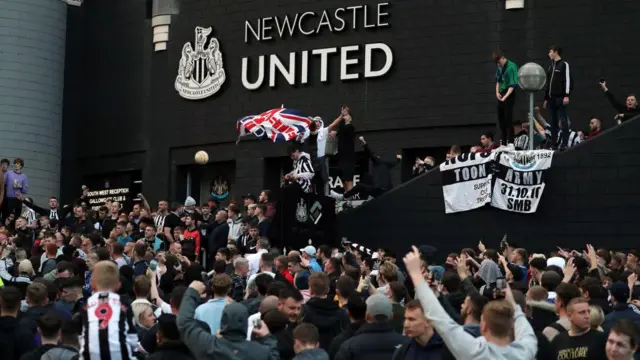 Newcastle fans gather to celebrate outside St. James' Park