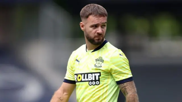 Adam Armstrong frowning  