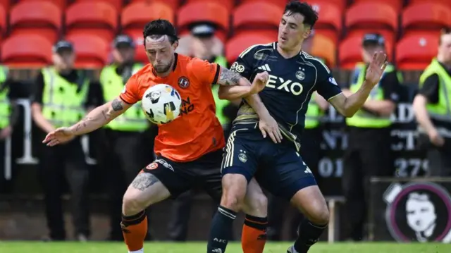 Dundee United's Will Ferry (L) and Aberdeen's Jamie McGrath in action during a William Hill Premiership match between Dundee United and Aberdeen at the CalForth Construction Arena at Tannadice Park,