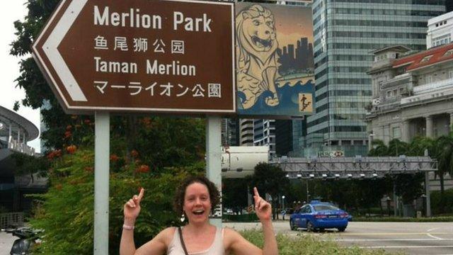 Amanda with a brown sign