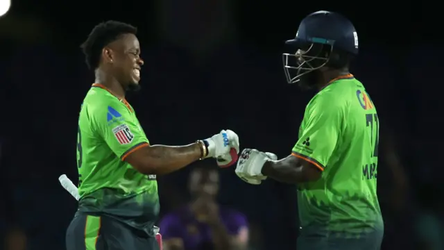 Shimron Hetmyer celebrates with Kyle Mayers 