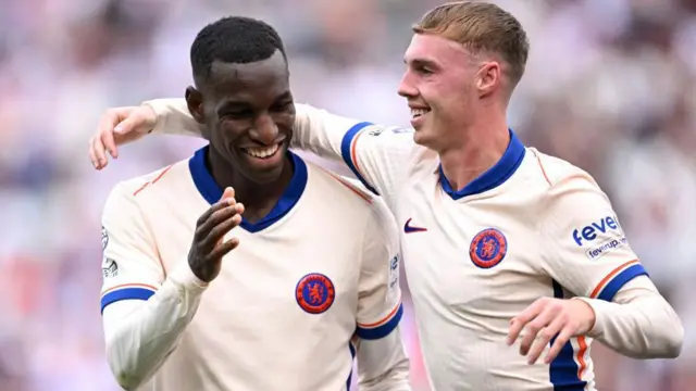 Chelsea's Cole Palmer celebrates scoring his team's third goal with Nicolas Jackson during the Premier League match between West Ham United and Chelsea at the London Stadium.