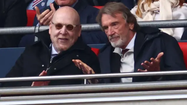 Avram Glazer and Sir Jim Ratcliffe sit together at a Manchester United match