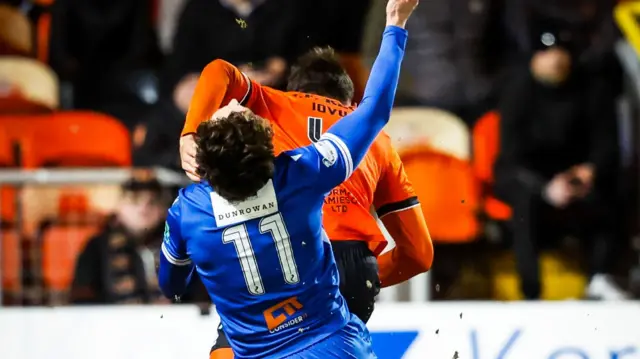 Dundee United's Iurie Iovu blocks Spartans' Cammy Russell