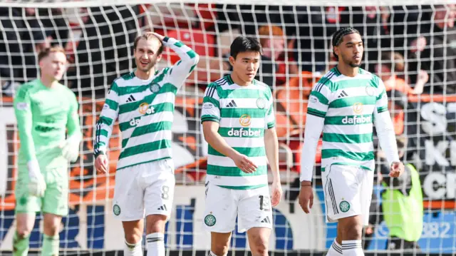 Celtic players look dejected during their Premiership defeat by Dundee United