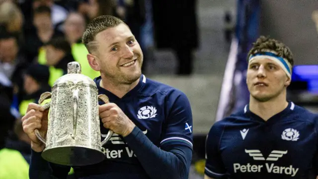 Finn Russell and Rory Darge parade the Calcutta Cup in 2024