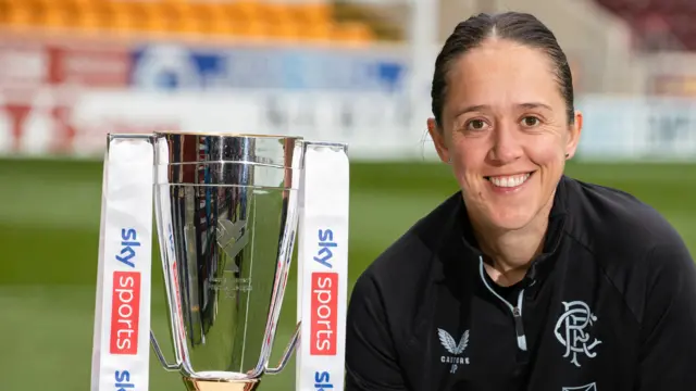 Rangers Head Coach Jo Potter with the Sky Sports Cup trophy during a press conference ahead of the Sky Sports Cup Final at Fir Park