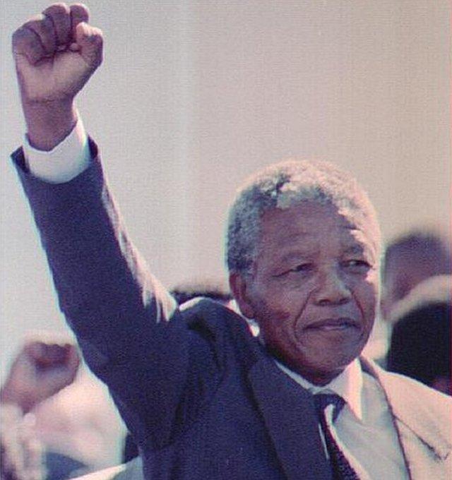 Nelson Mandela in 1990, raising his fist on release from prison