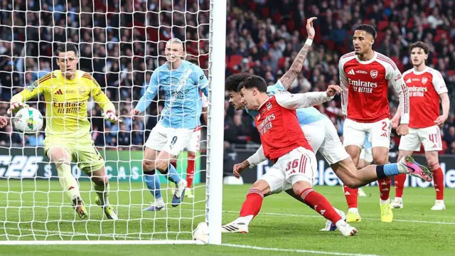 Nico O'Reilly of Manchester City scores their first goal