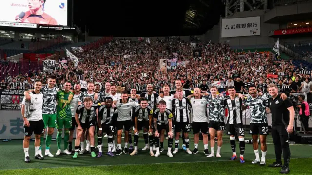 Newcastle United Players and coaching staff pose for a photo with the Japanese Fans