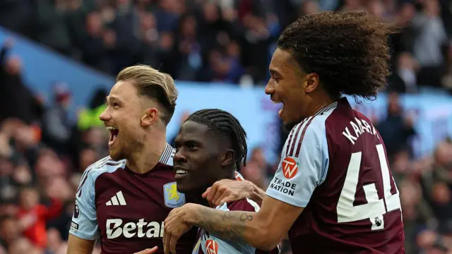 Matty Cash, Amadou Onana and Boubacar Kamara celebrate