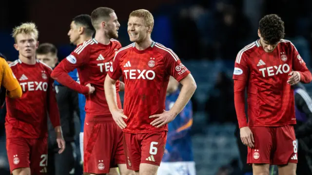 Aberdeen players dejected at Ibrox