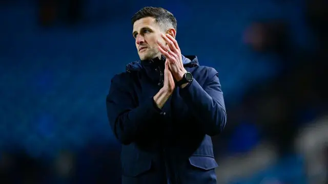 Portsmouth boss John Mousinho applauds the fans 