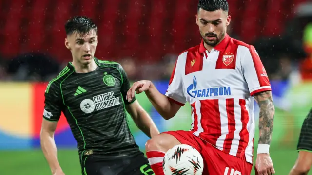 Red Star's Nemanja Radonjic (R) and Celtic's Kieran Tierney