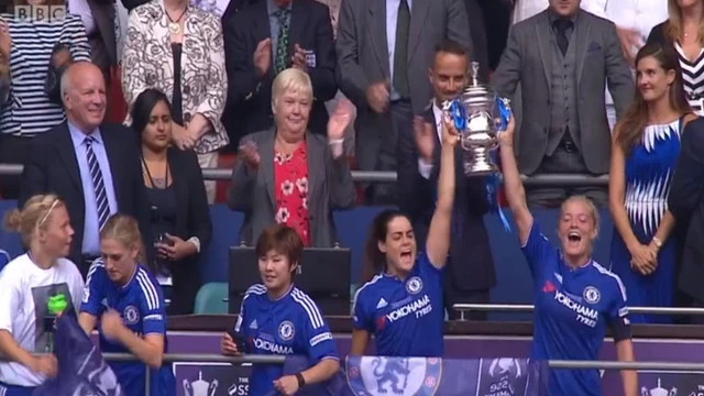 Katie Chapman lifts the FA Cup for Chelsea