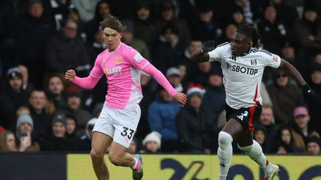 Tyler Dibling of Southampton battles Calvin Bassey of Fulham