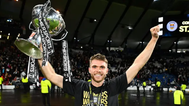 St Mirren's Marcus Fraser celebrates with the Premier Sports Cup Trophy during a Premier Sports Cup Final match between St Mirren and Celtic at Barclays Hampden