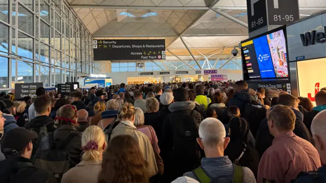 Airport security packed full of passengers 
