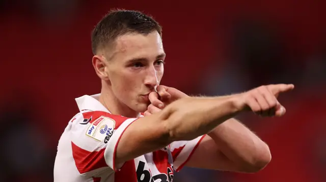 Stoke City's Robert Bozenik points to the crowd in celebration of his goal against Hull City in the EFL Cup on Tuesday