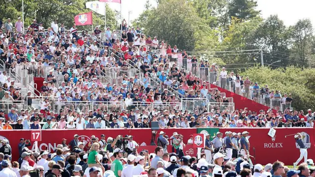 A wide shot of the grandstand at the17th tee
