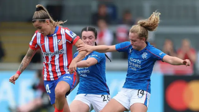 Rangers players in action v Atletico Madrid