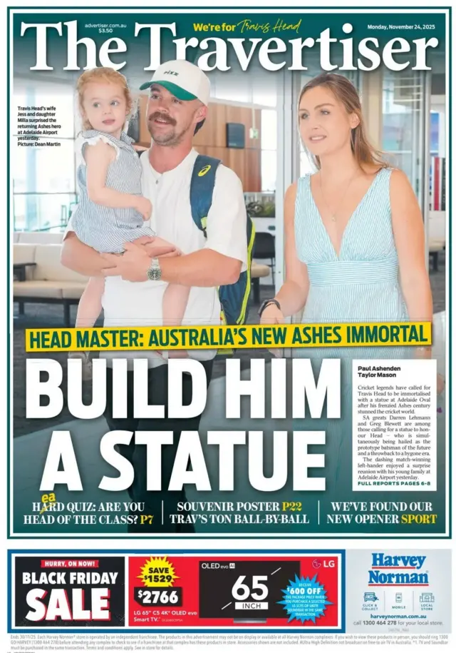 The back page of the Adelaide Advertiser on Monday, 24 November, featuring a photo of Travis Head with his family and the headline "Build him a statue"