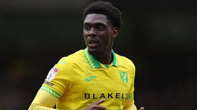 Mohamed Toure in his yellow Norwich City shirt.