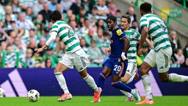 Anthony Elanga of Newcastle United (20) passes the ball during the pre-season friendly match between Celtic and Newcastle