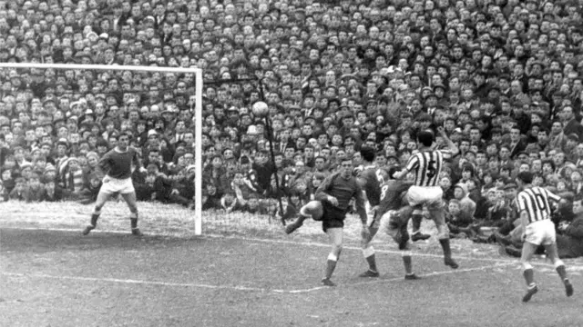 Charlie Hurley out jumps the Everton defence and heads across the goalmouth