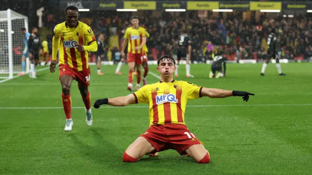 Watford winger Rocco Vata knee sliding at Vicarage Road.