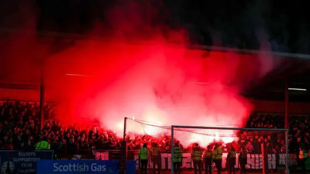 Falkirk fans set off flares during the cup win at local rivals Stenhousemuir