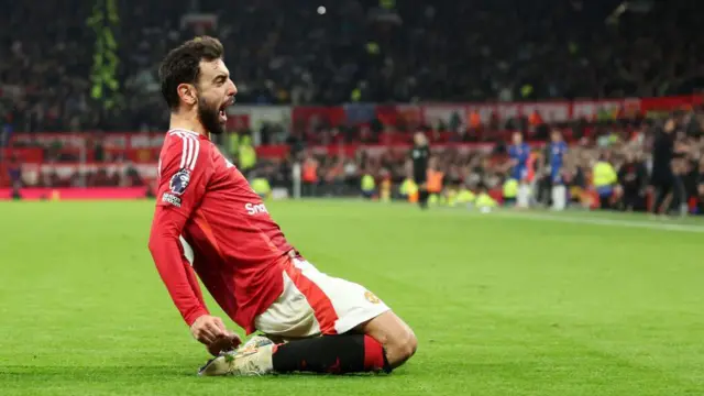 Bruno Fernandes of Manchester United celebrates after scoring his team's first goal from a penalty kick during the Premier League match between Manchester United FC and Chelsea FC at Old Trafford