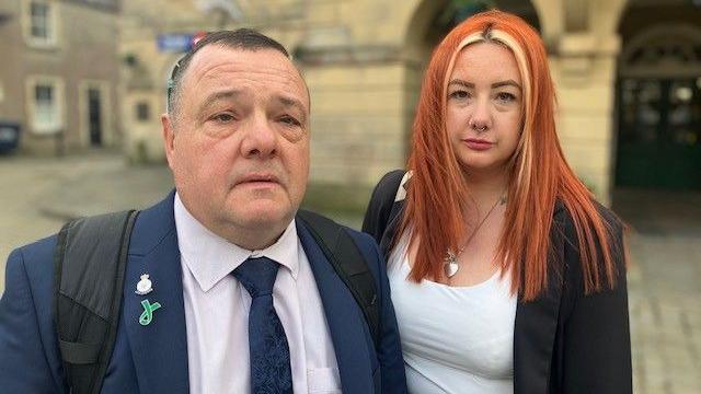 John Powell and daughter Lucy are standing in front of the Coroner's court in Taunton. 