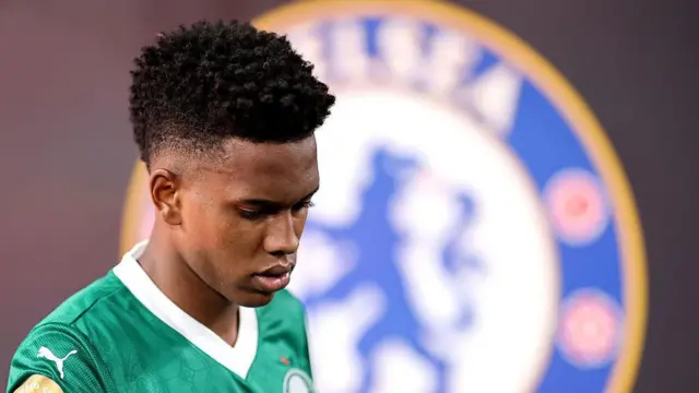 Estevao of Palmeiras walks out of the tunnel before the Club World Cup quarter final match between Palmeiras and Chelsea with the Chelsea badge in the background