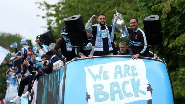 Coventry City celebrate on open-top bus