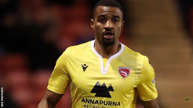 Christian Mbulu in action for Morecambe at Walsall in League Two in January 20202