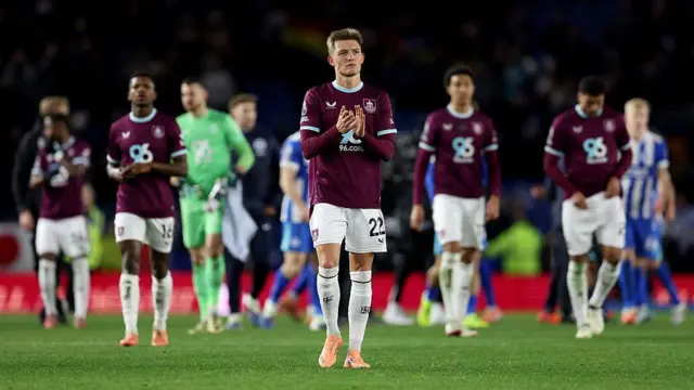 Oliver Sonne of Burnley applauds the fans