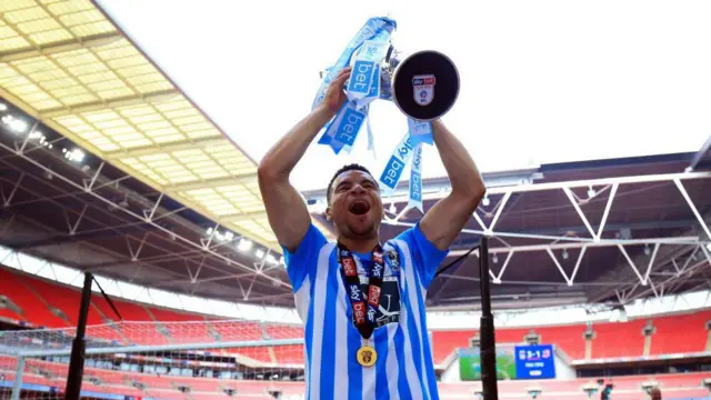 Coventry player lifts Championship trophy