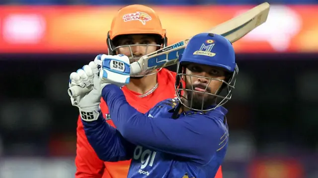 Nicholas Pooran plays a shot for MI Emirates