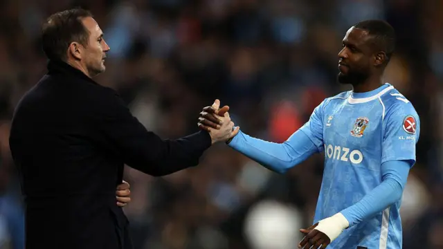 Frank Onyeka shakes hands with Frank Lampard