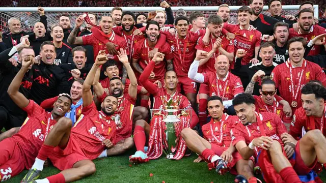 Liverpool players with the Premier League trophy
