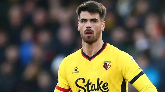 Joao Ferreira in his yellow Watford shirt in action during a game
