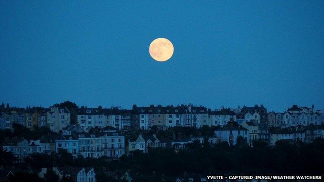 Full moon over houses